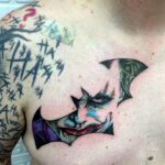 Joker tattoo on chest