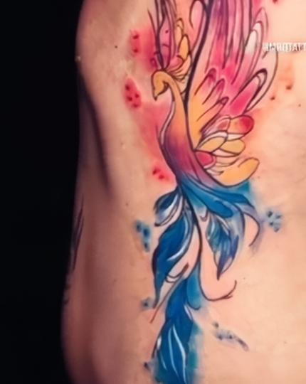 A beautiful water colour style phoenix tattoo