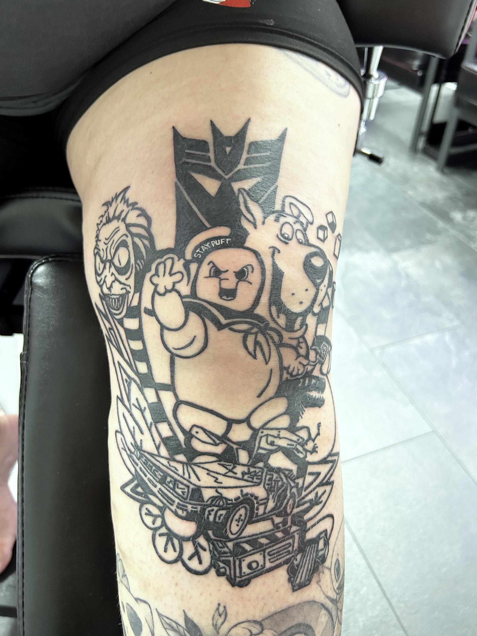 80s and 90s character leg tattoo