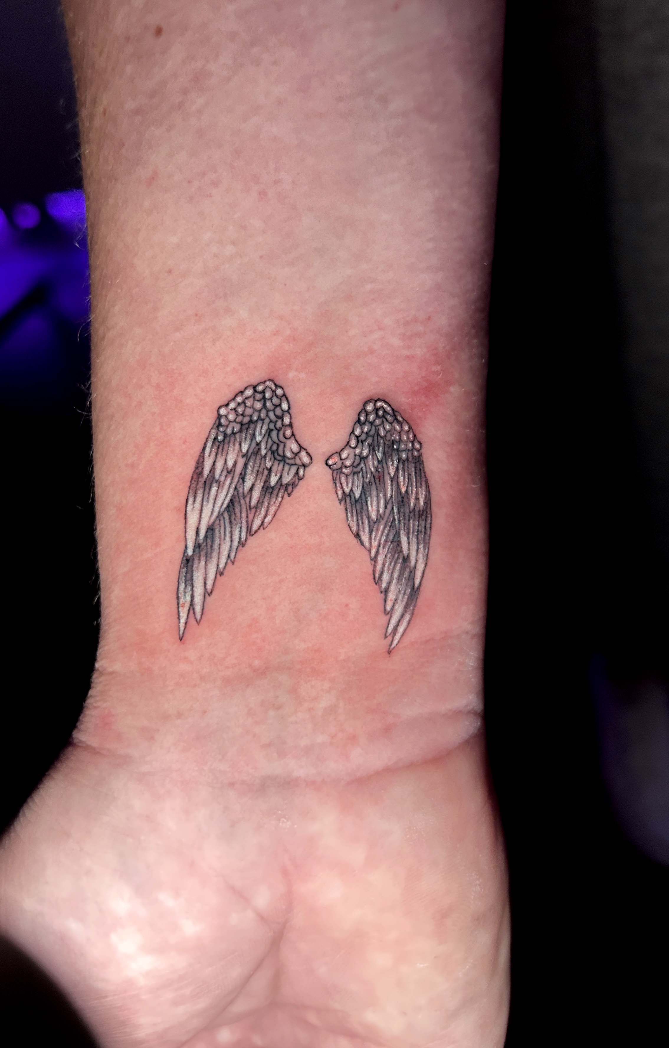 Subtle angel wings tattoo