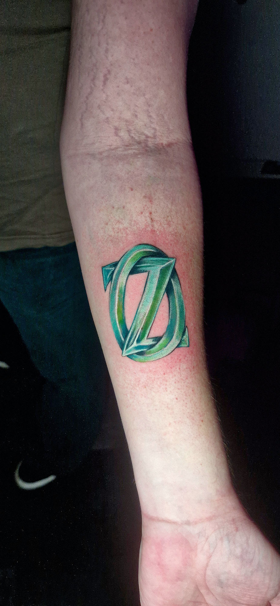 Wizard of Oz tattoo on forearm